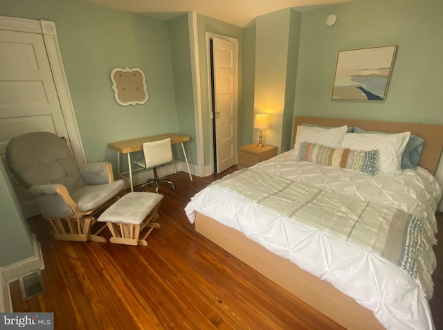 bedroom featuring dark hardwood / wood-style floors