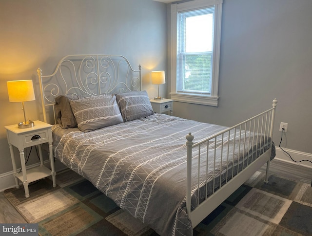 bedroom with hardwood / wood-style flooring