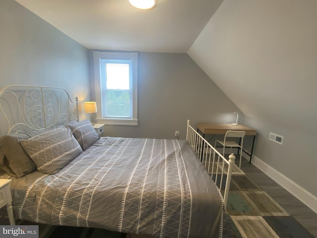 bedroom featuring lofted ceiling