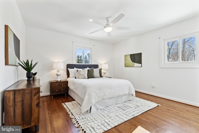 bedroom featuring dark hardwood / wood-style flooring and ceiling fan