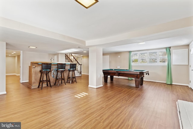 playroom featuring billiards, light hardwood / wood-style flooring, and indoor bar