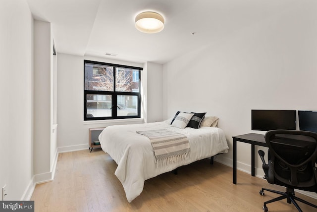 bedroom featuring light hardwood / wood-style flooring