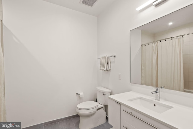 bathroom with toilet, tile patterned flooring, a shower with curtain, and vanity