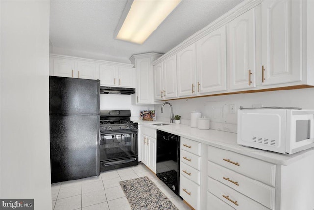 kitchen featuring sink, white cabinets, black appliances, and light tile patterned flooring