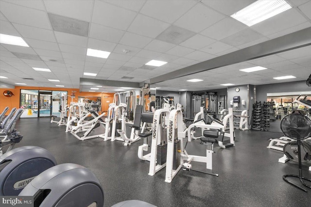 workout area featuring a paneled ceiling