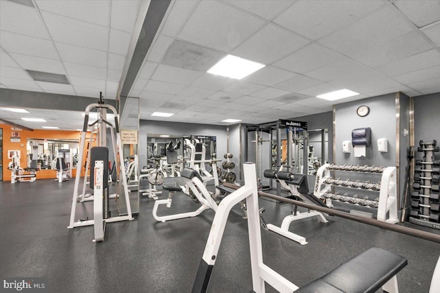 workout area featuring a drop ceiling