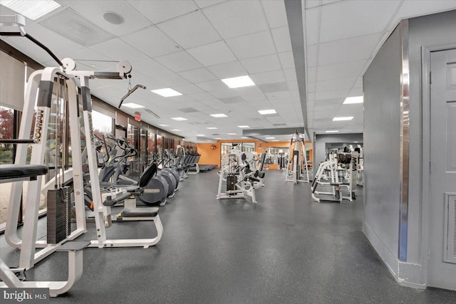 workout area with a paneled ceiling