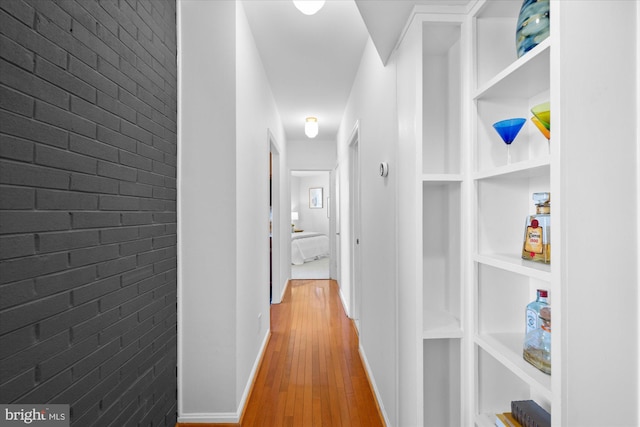 hall with hardwood / wood-style floors