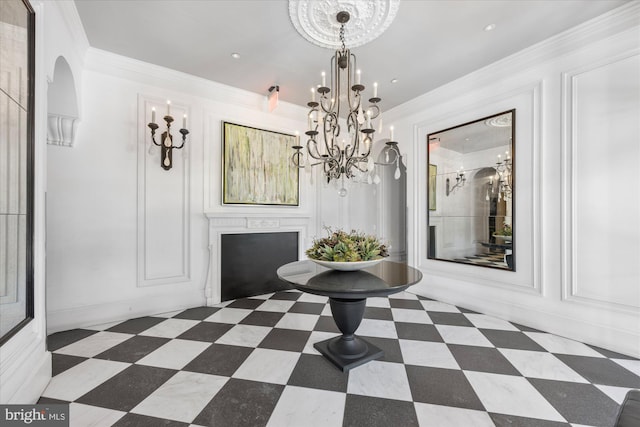 unfurnished dining area with an inviting chandelier and crown molding