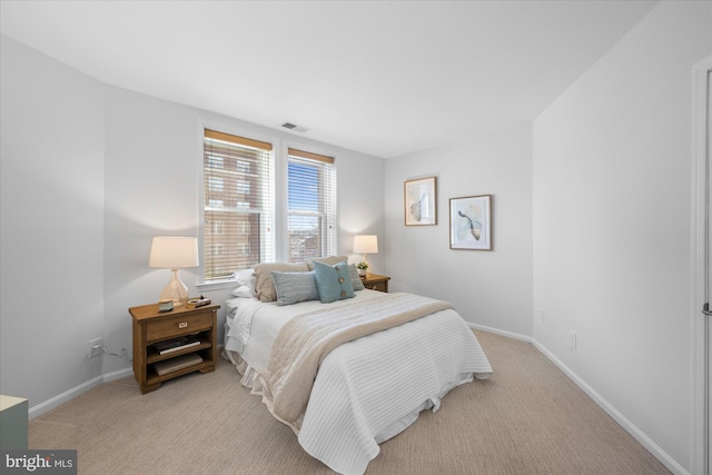 bedroom with light carpet