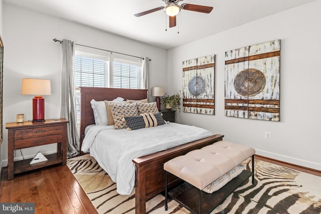 bedroom with hardwood / wood-style flooring and ceiling fan