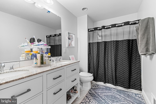 bathroom with vanity, toilet, and a shower with shower curtain