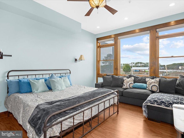 bedroom featuring hardwood / wood-style flooring and ceiling fan