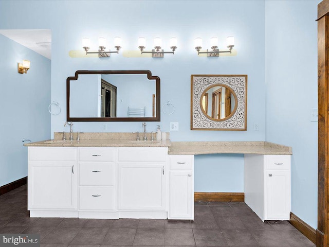 bathroom featuring tile patterned floors and vanity