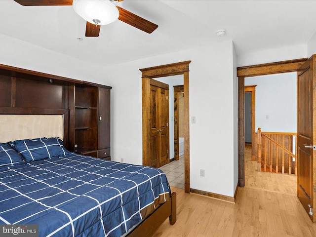 bedroom with ceiling fan and light wood-type flooring