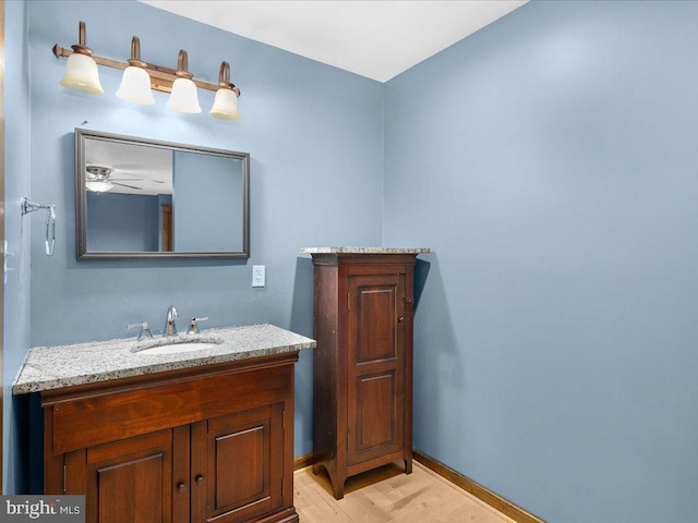 bathroom with vanity and ceiling fan