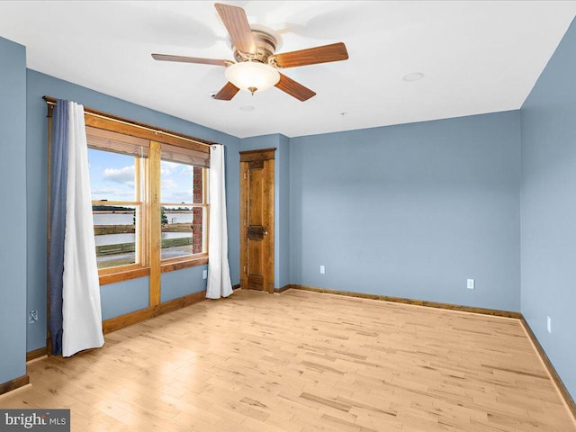 spare room with ceiling fan and light hardwood / wood-style floors