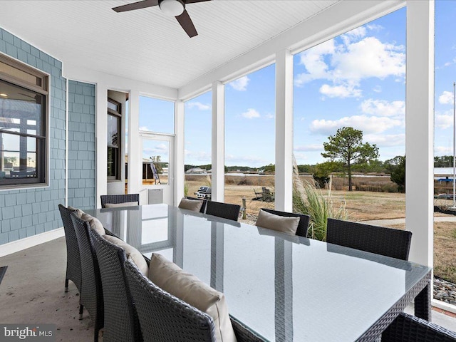 sunroom with ceiling fan and a wealth of natural light