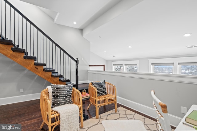 stairs featuring hardwood / wood-style floors