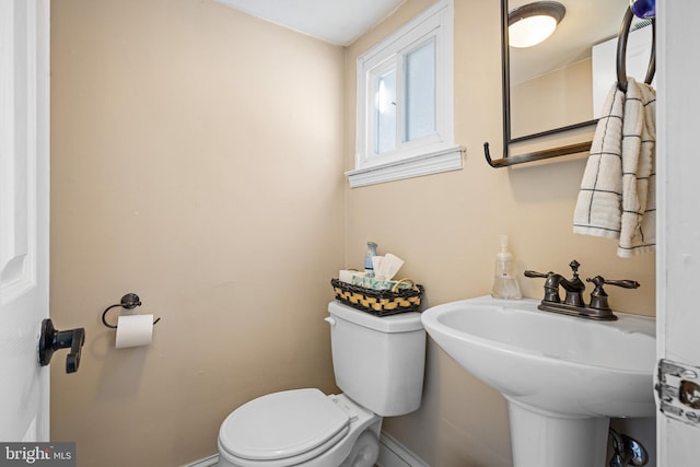 bathroom featuring sink and toilet