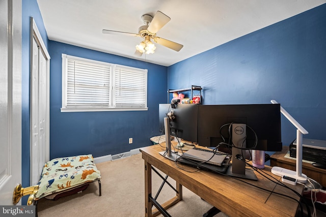 carpeted office with ceiling fan