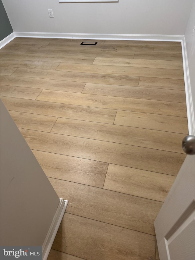 interior details featuring hardwood / wood-style flooring