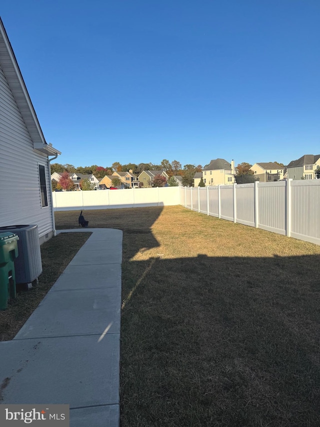 view of yard featuring central AC