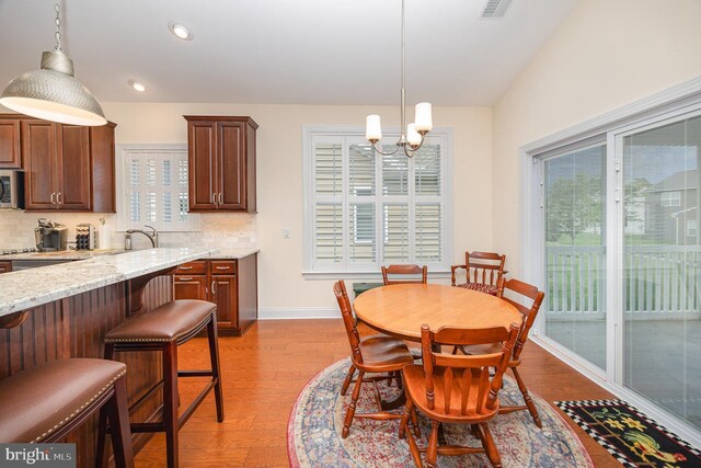 226 Loyal Dr, Mechanicsburg, PA 17050 - dining space with a chandelier, light wood-type flooring, healthy amount of natural light, baseboards, and recessed lighting