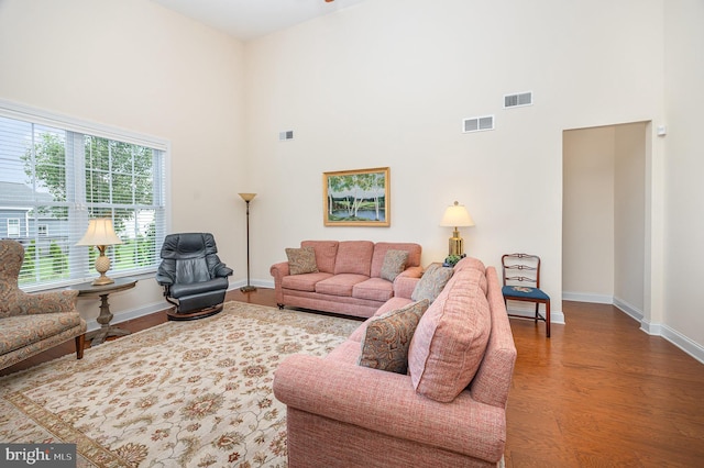 226 Loyal Dr, Mechanicsburg, PA 17050 - living area with a towering ceiling, baseboards, and wood finished floors