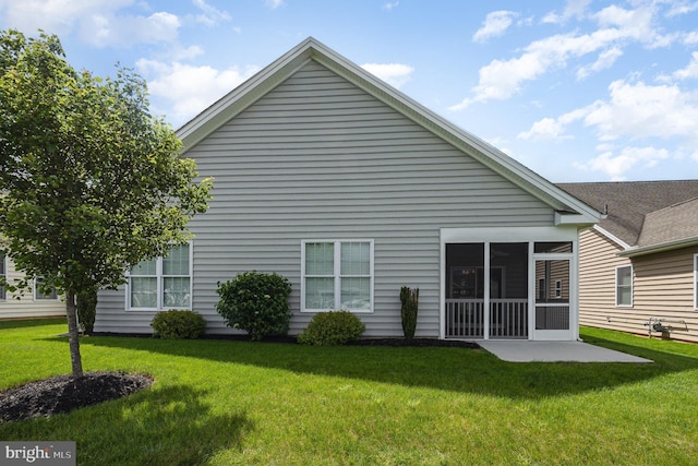 226 Loyal Dr, Mechanicsburg, PA 17050 - rear view of house with a lawn and a sunroom