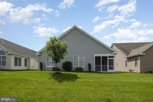 226 Loyal Dr, Mechanicsburg, PA 17050 - rear view of property featuring a lawn and a sunroom