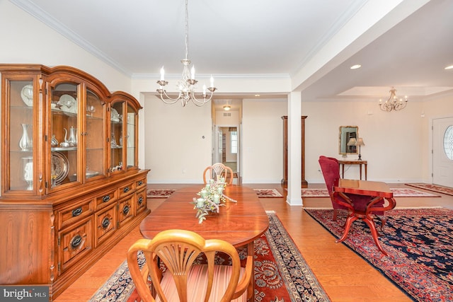 226 Loyal Dr, Mechanicsburg, PA 17050 - dining area with a chandelier, crown molding, light wood-style floors, and baseboards