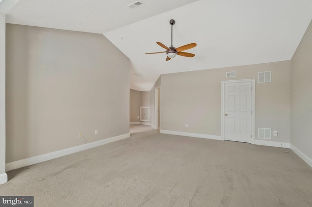 unfurnished living room with ceiling fan, vaulted ceiling, and light carpet