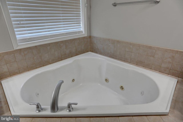 bathroom featuring a relaxing tiled tub