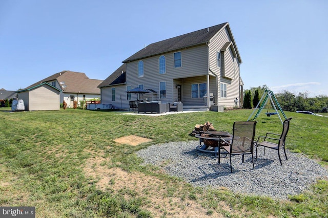 rear view of property with a lawn, a playground, central air condition unit, and a patio