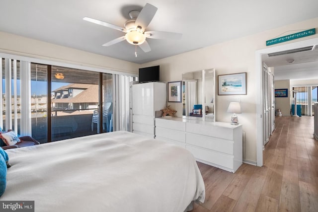 bedroom featuring ceiling fan, light wood-type flooring, and access to outside