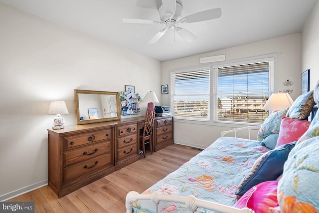 bedroom featuring ceiling fan and light hardwood / wood-style floors