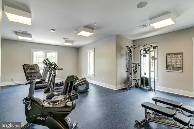 workout area with baseboards and visible vents
