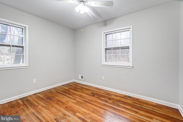 spare room featuring ceiling fan and light hardwood / wood-style floors