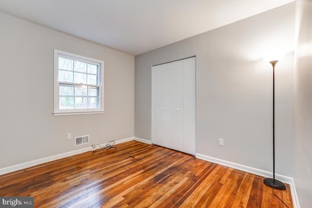 unfurnished bedroom featuring wood-type flooring