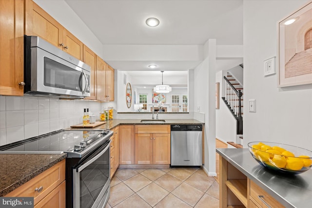 2518 S Walter Reed Dr Unit B, Arlington, VA 22206 - kitchen with stainless steel appliances, a sink, light tile patterned floors, stainless steel counters, and tasteful backsplash