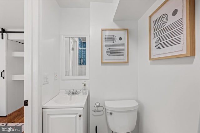 2518 S Walter Reed Dr Unit B, Arlington, VA 22206 - bathroom with vanity, toilet, and wood finished floors