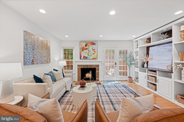 2518 S Walter Reed Dr Unit B, Arlington, VA 22206 - living room with healthy amount of natural light, wood finished floors, recessed lighting, french doors, and a fireplace