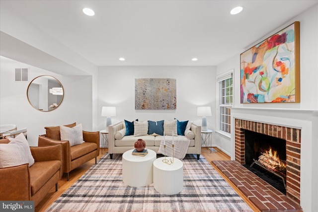 2518 S Walter Reed Dr Unit B, Arlington, VA 22206 - living room featuring light wood finished floors, recessed lighting, and a brick fireplace