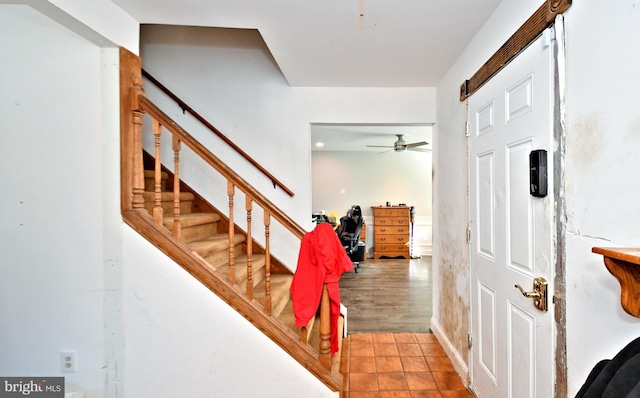 staircase with ceiling fan