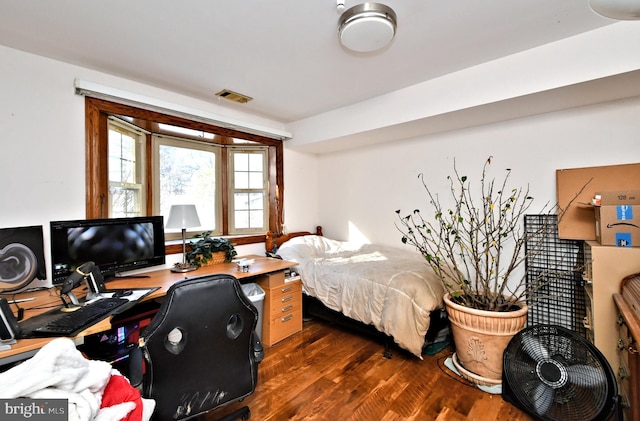 bedroom featuring dark wood-type flooring