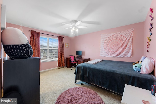 carpeted bedroom featuring ceiling fan