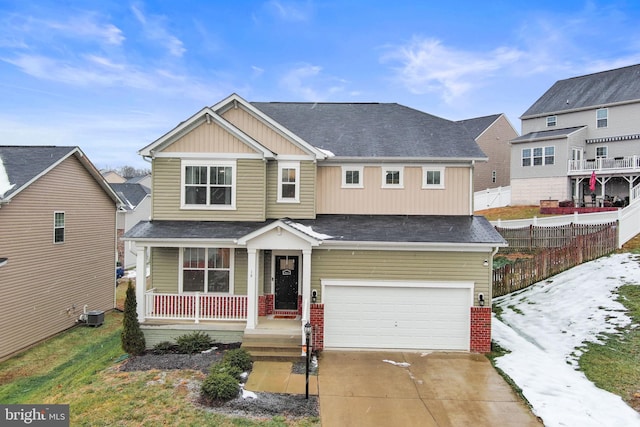 view of front of home with a porch and a garage