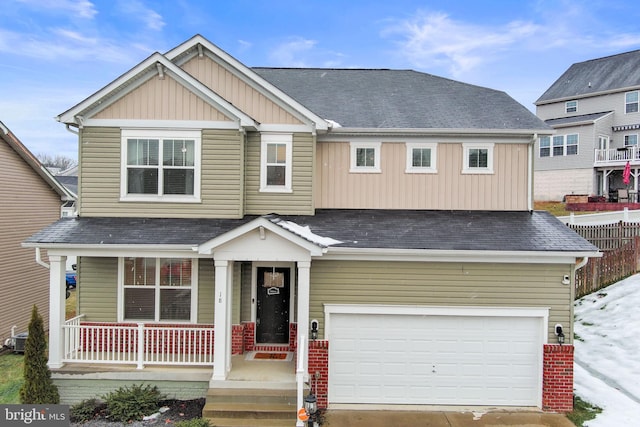 craftsman house with cooling unit, covered porch, and a garage