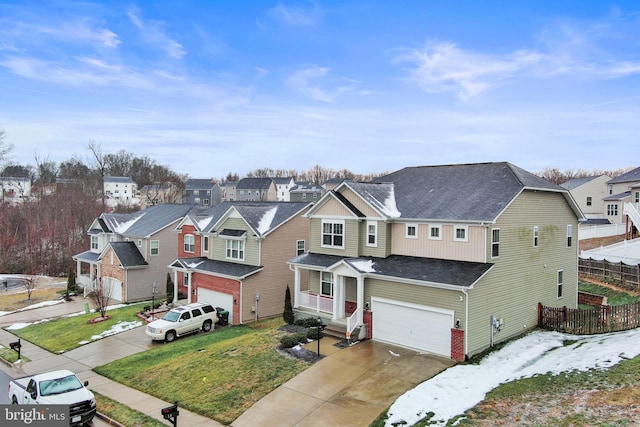 view of front of home featuring a front yard and a garage